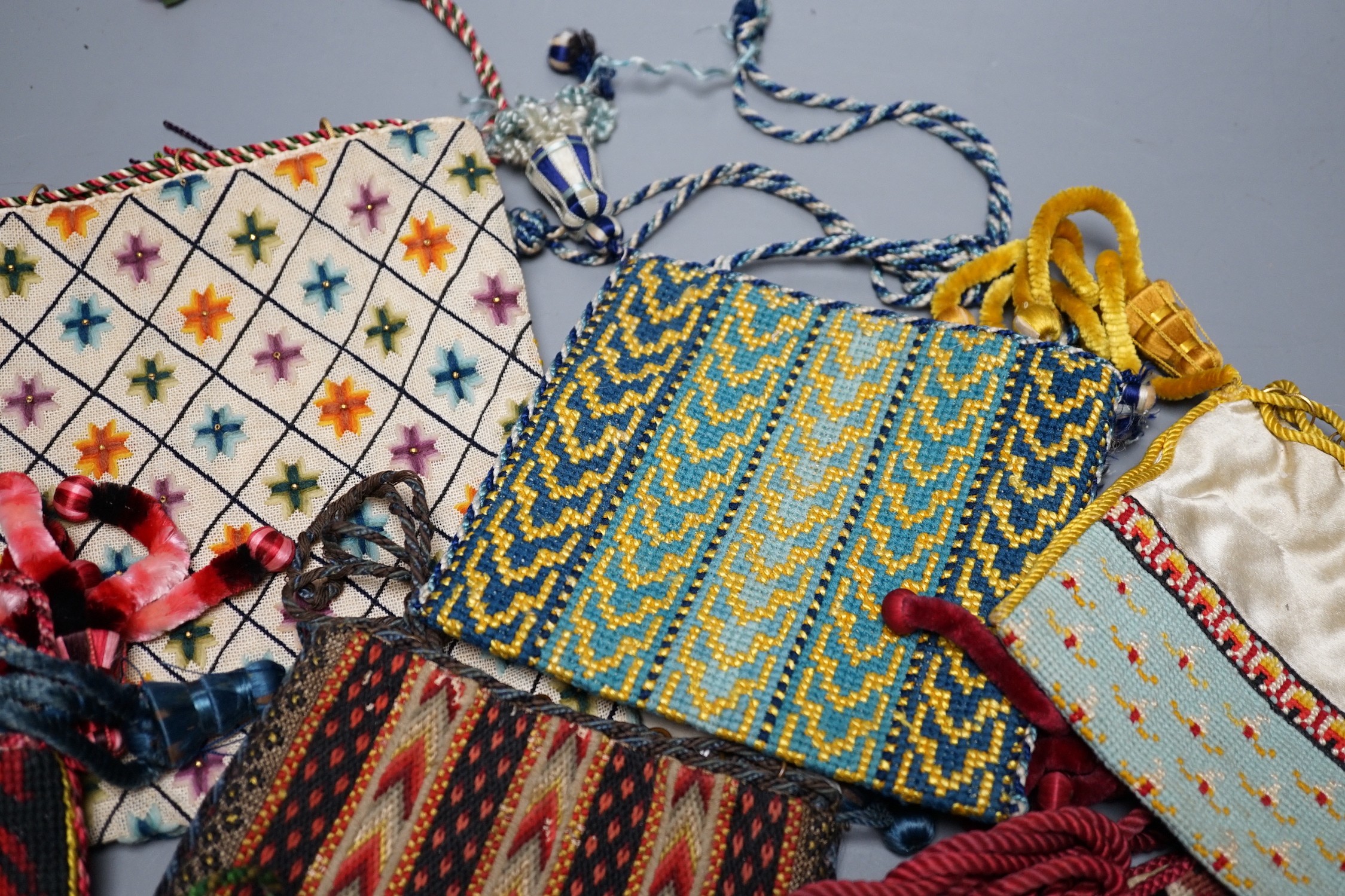 Ten 19th century embroidered and woolworked bible bags, largest 18 x 16cm